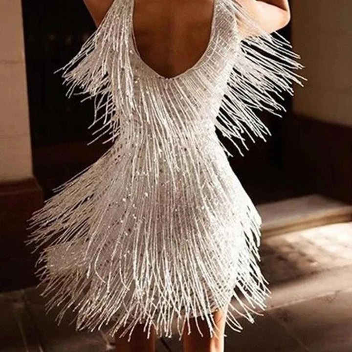 Playful white mini party dress for women with gold tassels, a stylish and elegant choice.