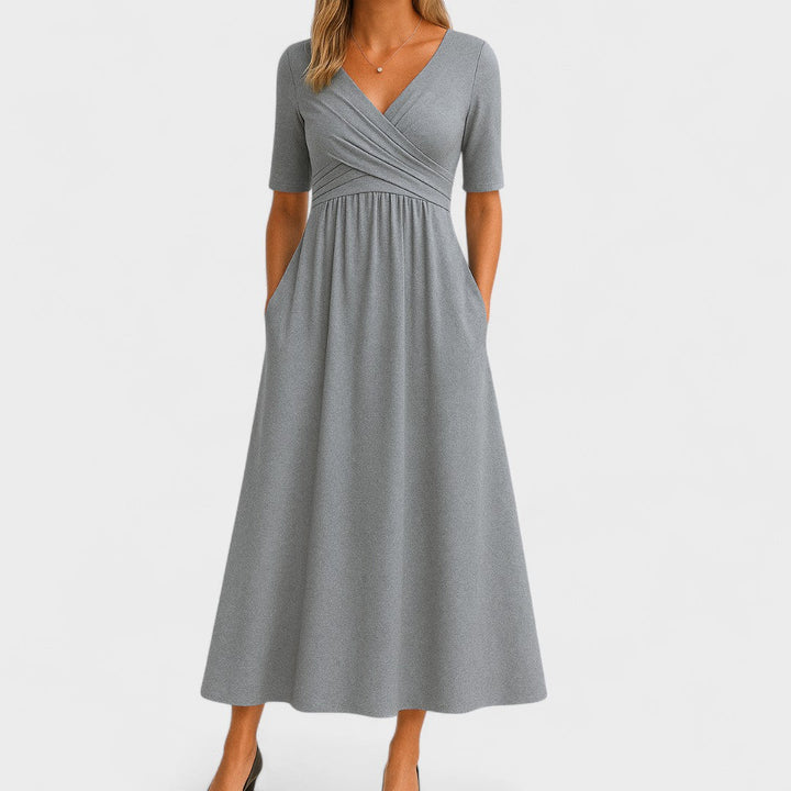 Elegant women's V-neck midi dress with short sleeves, perfect for summer parties or casual wear. Flattering chic style.
