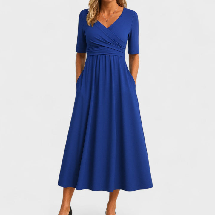 Flattering V-neck midi dress for women, ideal for summer elegance or casual comfort. Chic short sleeve design.