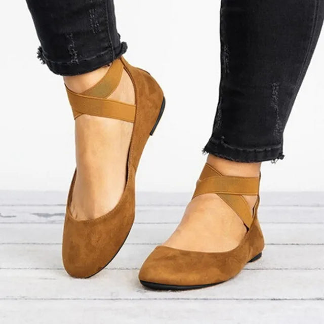 Comfortable women's slip-on ballet flats featuring a secure and fashionable cross-strap design.