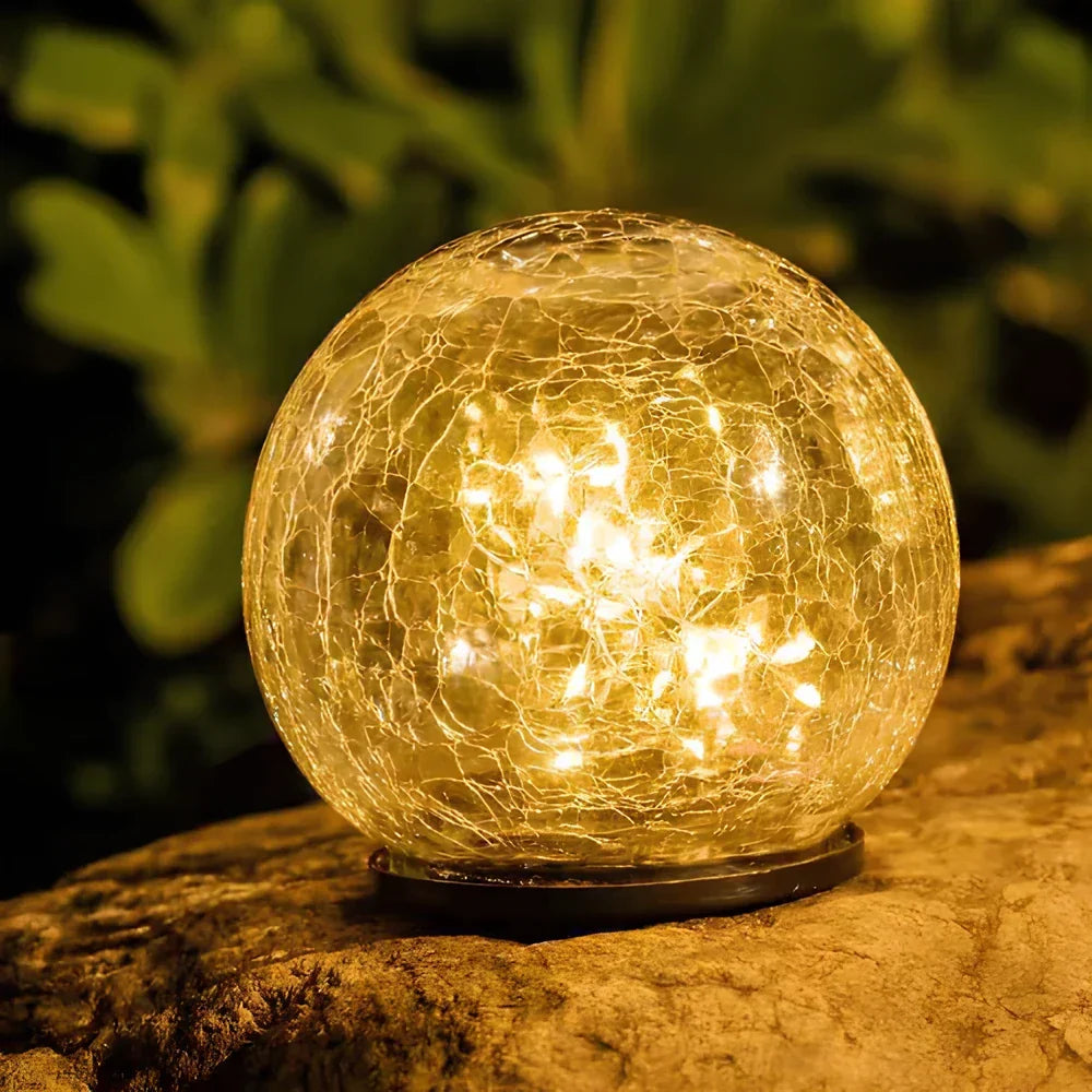 Crackled glass solar orb garden light, warm white LED, outdoor decorative patio light.
