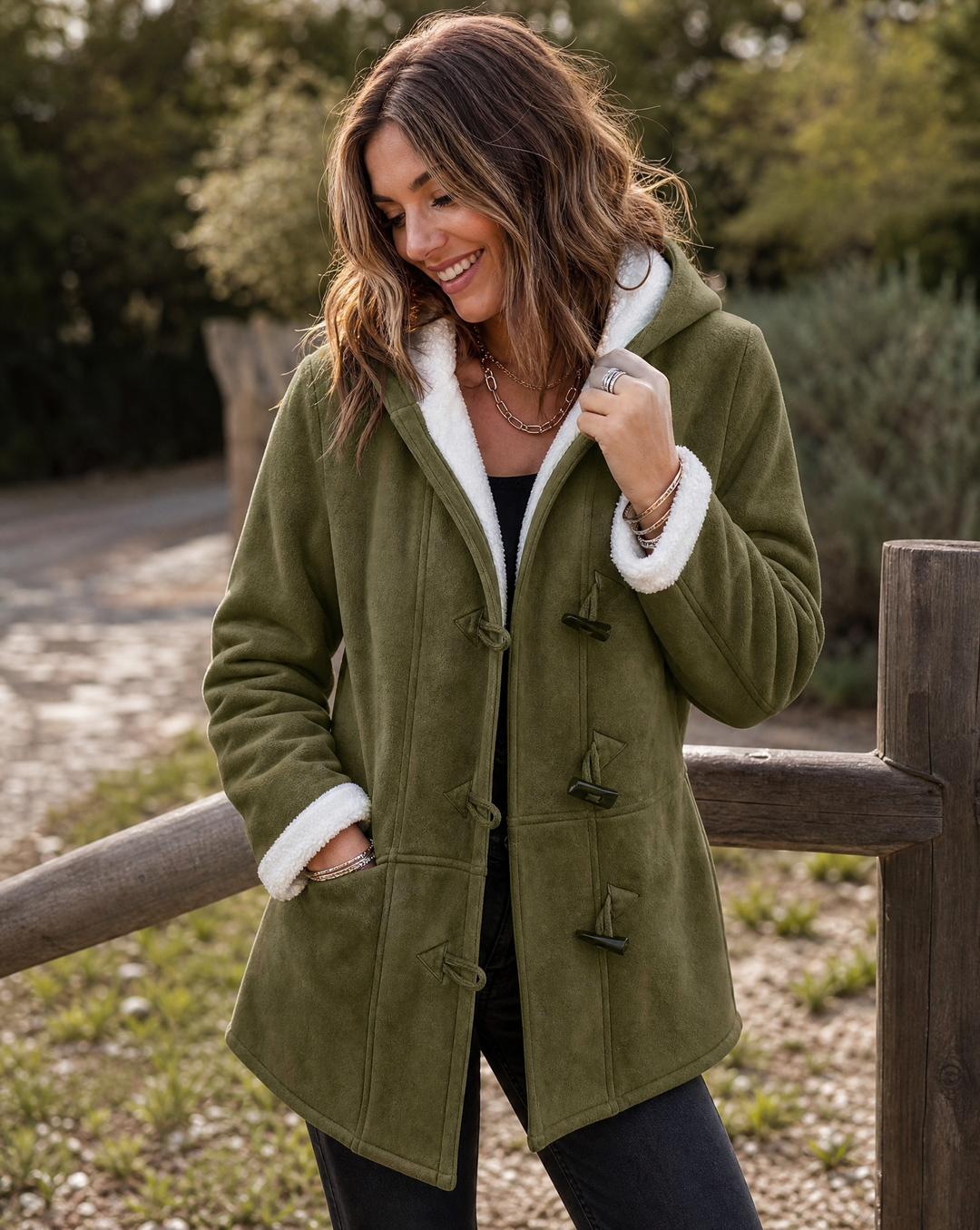 Women's warm hooded winter coat with toggle closure, ideal for cold weather style and comfort.