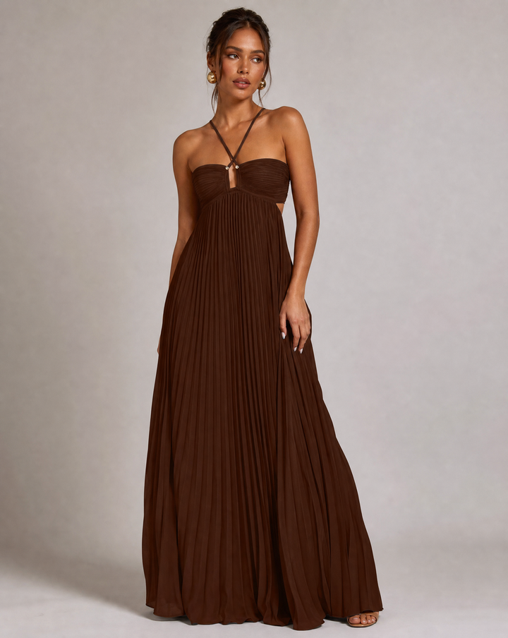 Chic flowy pleated maxi dress with a halter neck & open back, ideal for wedding guests & parties.