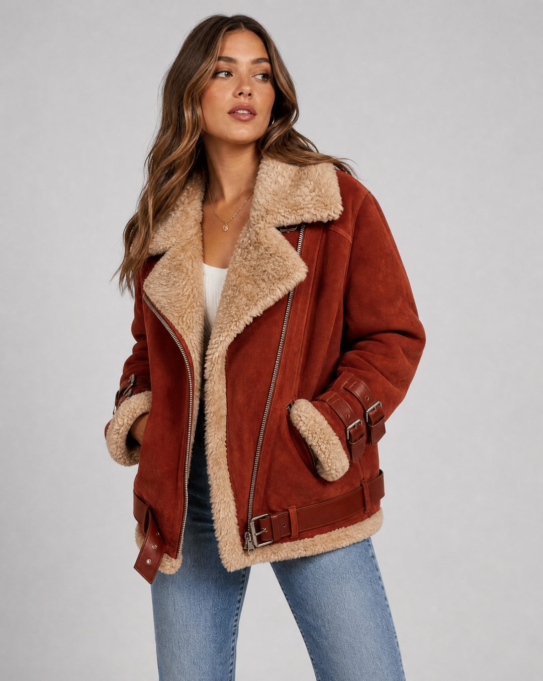 Warm women's outerwear: a stylish belted jacket with functional pockets for winter.
