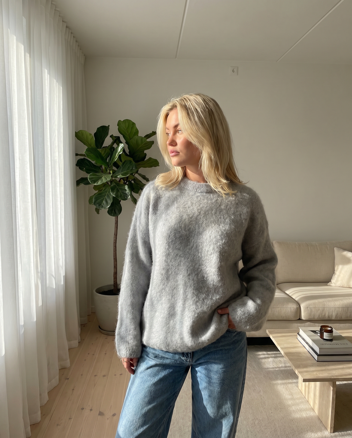 Elegant women's knit sweater, long sleeve, perfect for fall & winter style.