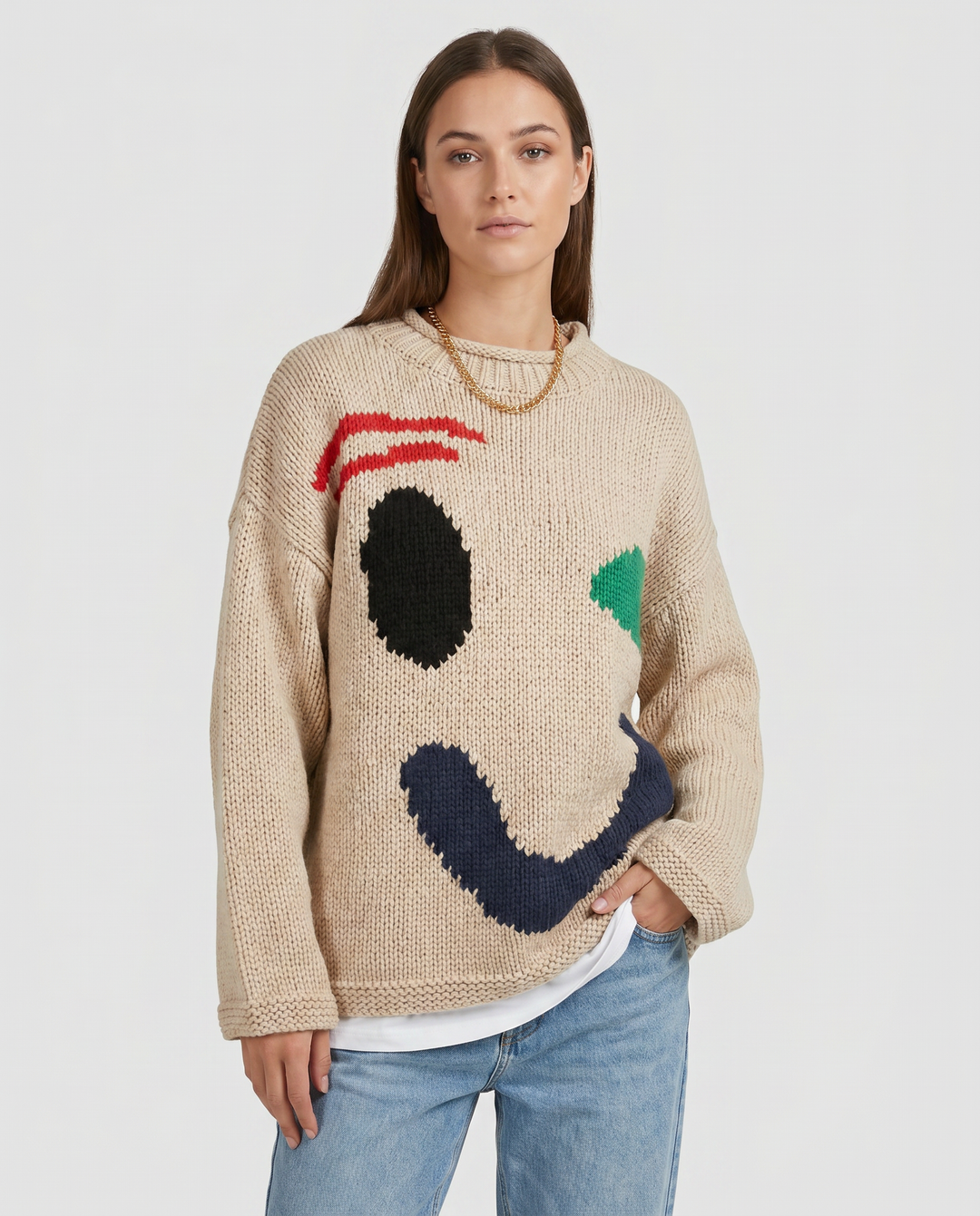 Long sleeve oversized smiley face women's knit cardigan. Casual and cozy winter wear fashion statement.
