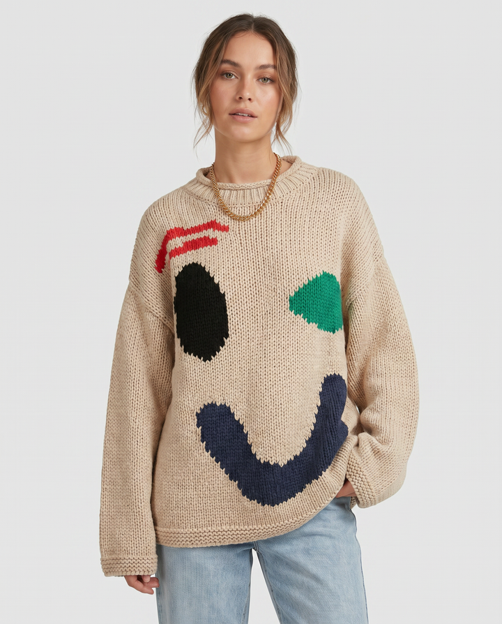 Cozy women's oversized smiley face sweater cardigan, ideal for fall & winter comfort. A trendy fashion piece.