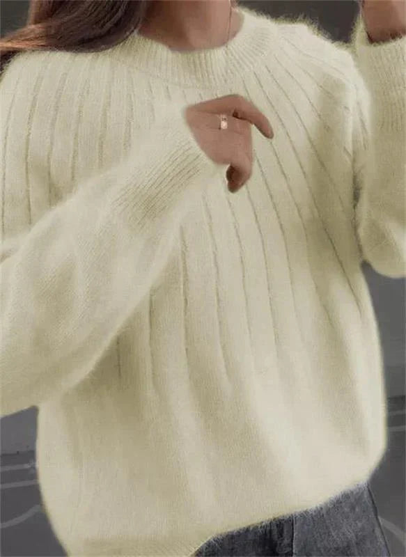 Women's elegant long-sleeve knit sweater. Comfortable pullover, ideal for fall & winter style. Soft knit fabric.