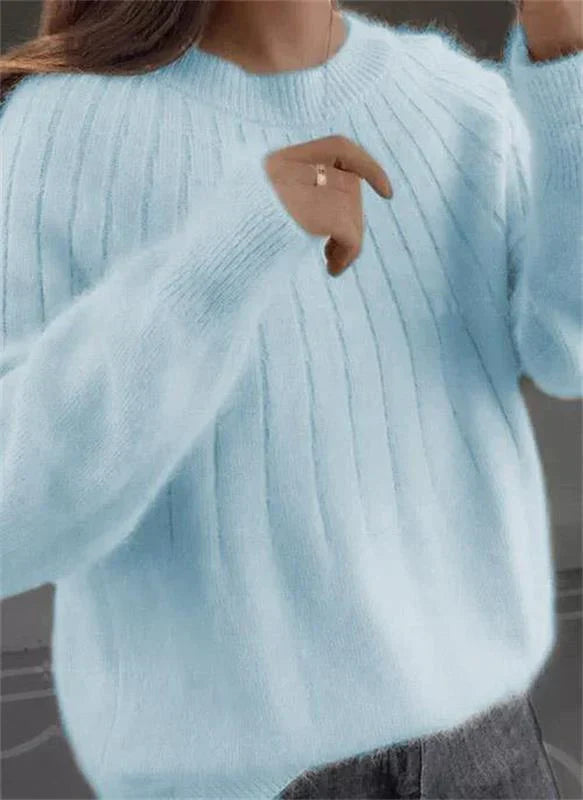 Casual chic women's elegant knit sweater. Soft long-sleeve pullover, perfect for comfortable fall & winter style.