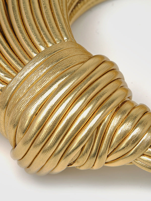 Elegant gold twisted hoop bag, a stylish fashion accessory for women. Perfect statement purse.