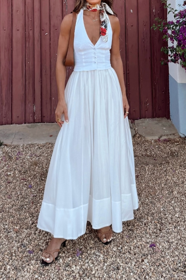 Women's flowing white maxi summer party dress with an elegant v-neck. Perfect for warm weather occasions & sophisticated style.