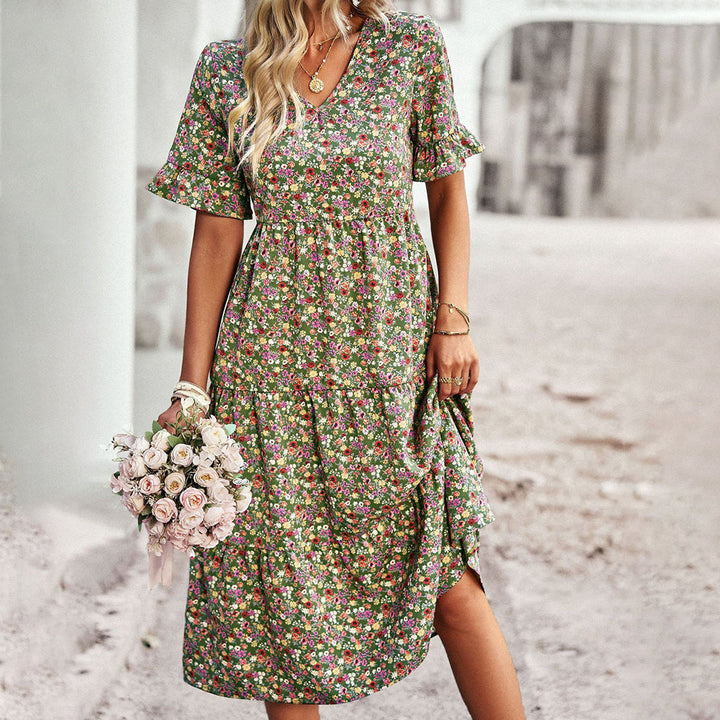 Flowy women's bohemian midi dress in a vibrant floral print, ideal for summer fashion and casual chic apparel.