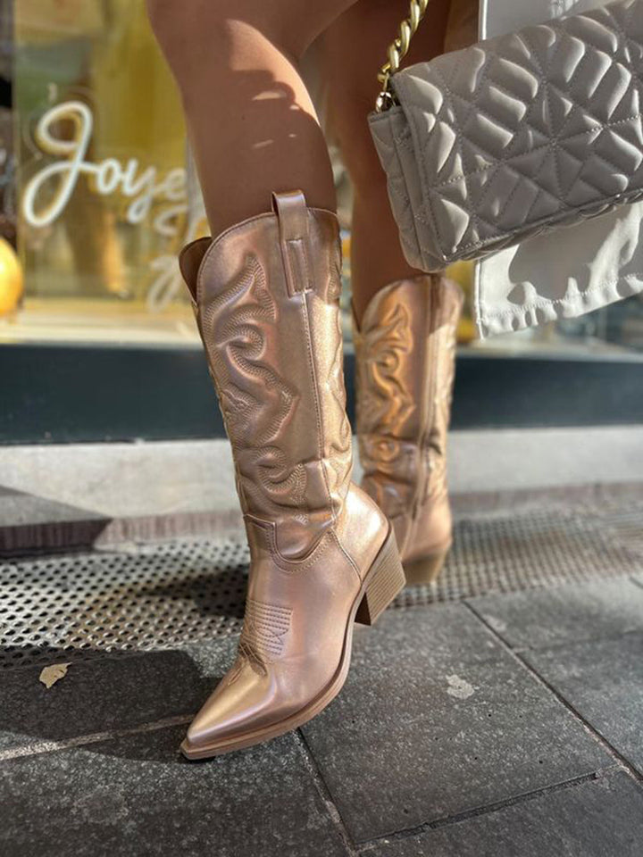 Glamorous women's metallic cowboy boots, perfect for adding a sparkling touch to any outfit.