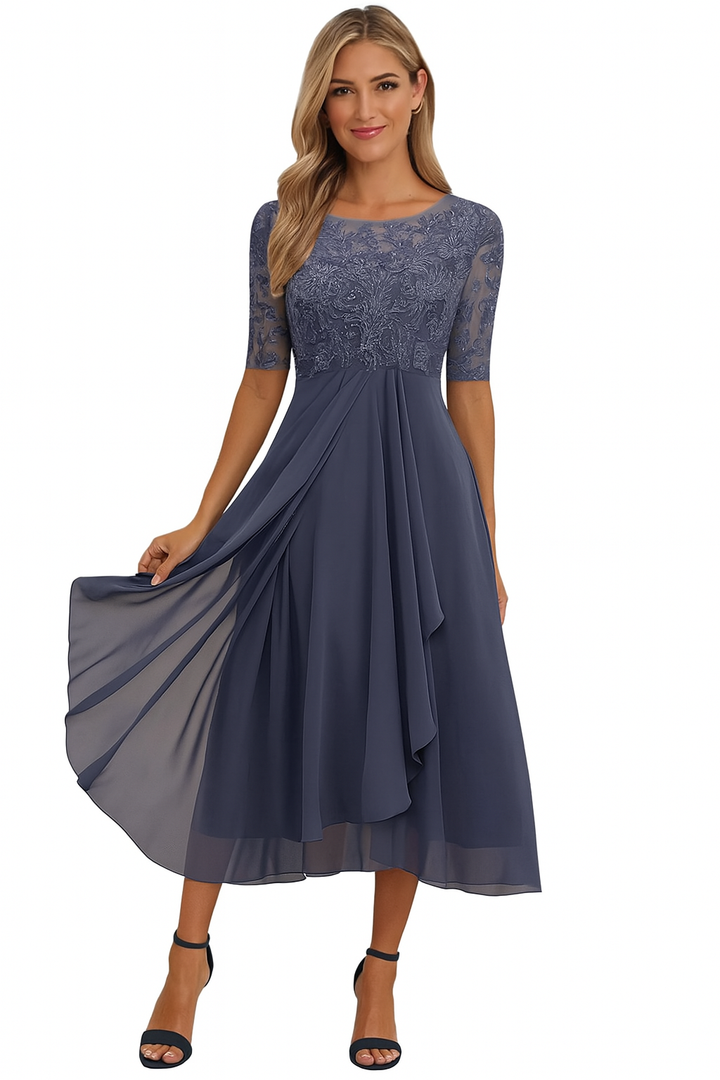 Women's elegant A-line midi dress, three-quarter sleeves, flowy fabric, perfect for summer.