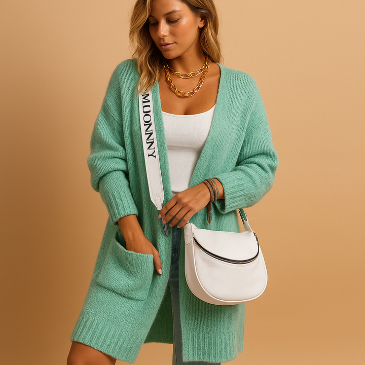 Chic women's long oversized cardigan vest, ideal for fall & spring layering. Comfortable & versatile everyday fashion.