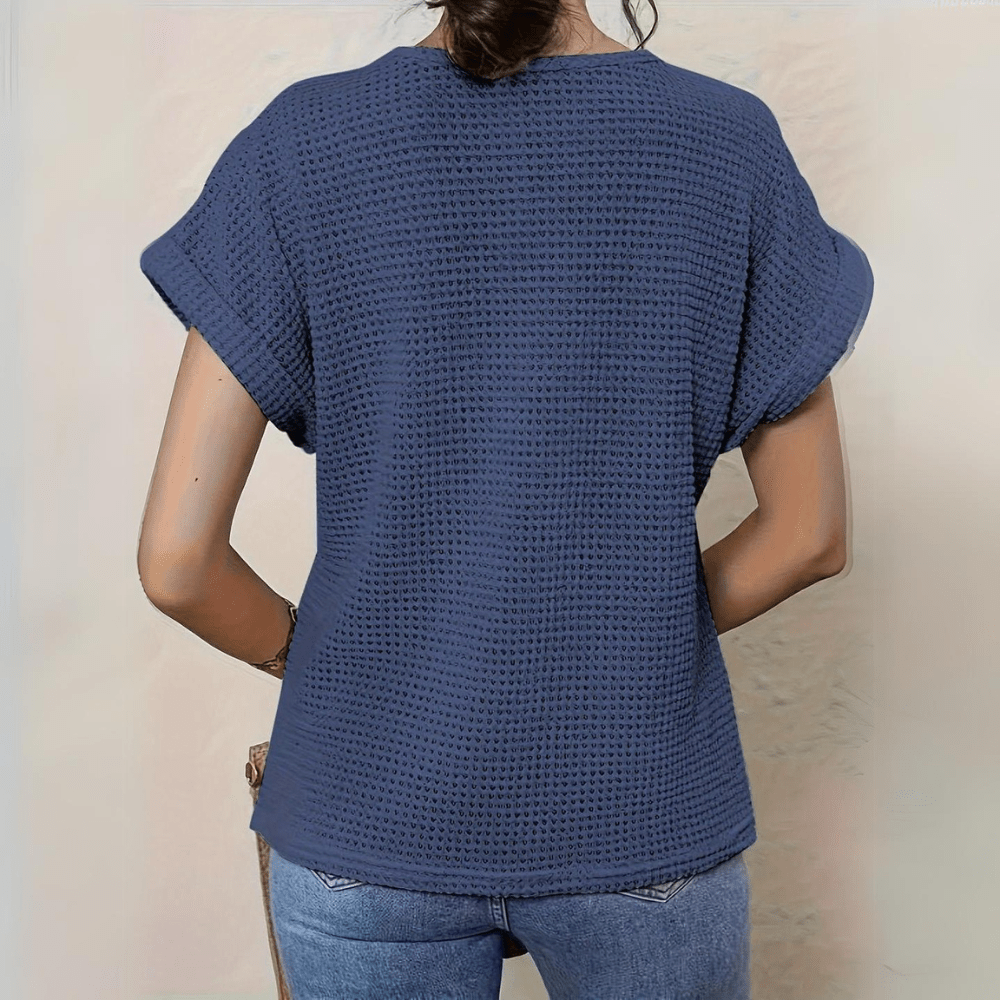 Feminine women's top featuring exquisite vintage lace accents and a long sleeve design.