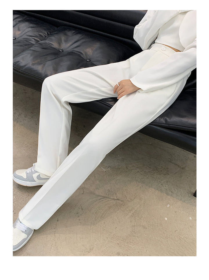 White women's high waist wide leg trousers. Elegant palazzo pants, comfortable for modern versatile fashion.