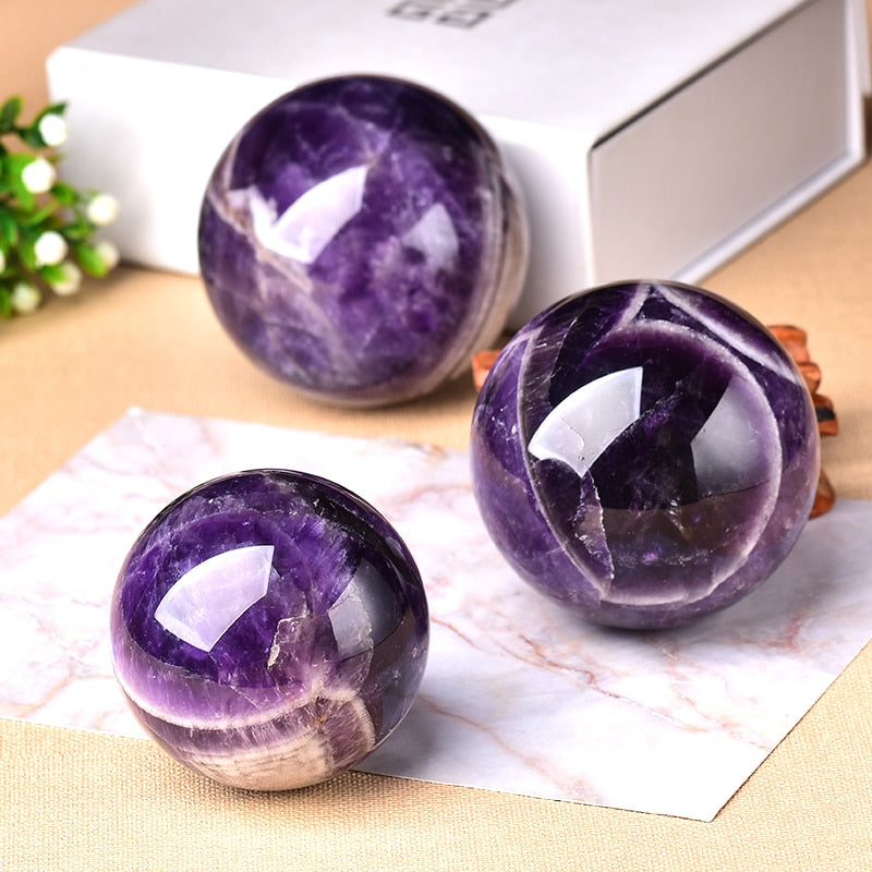 Vibrant purple amethyst gemstone sphere, a beautiful spiritual decor item.