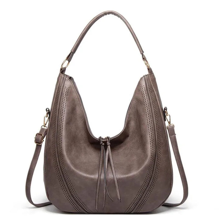 Durable women's vintage leather handbag, a timeless shoulder bag perfect for everyday fashion and classic style.