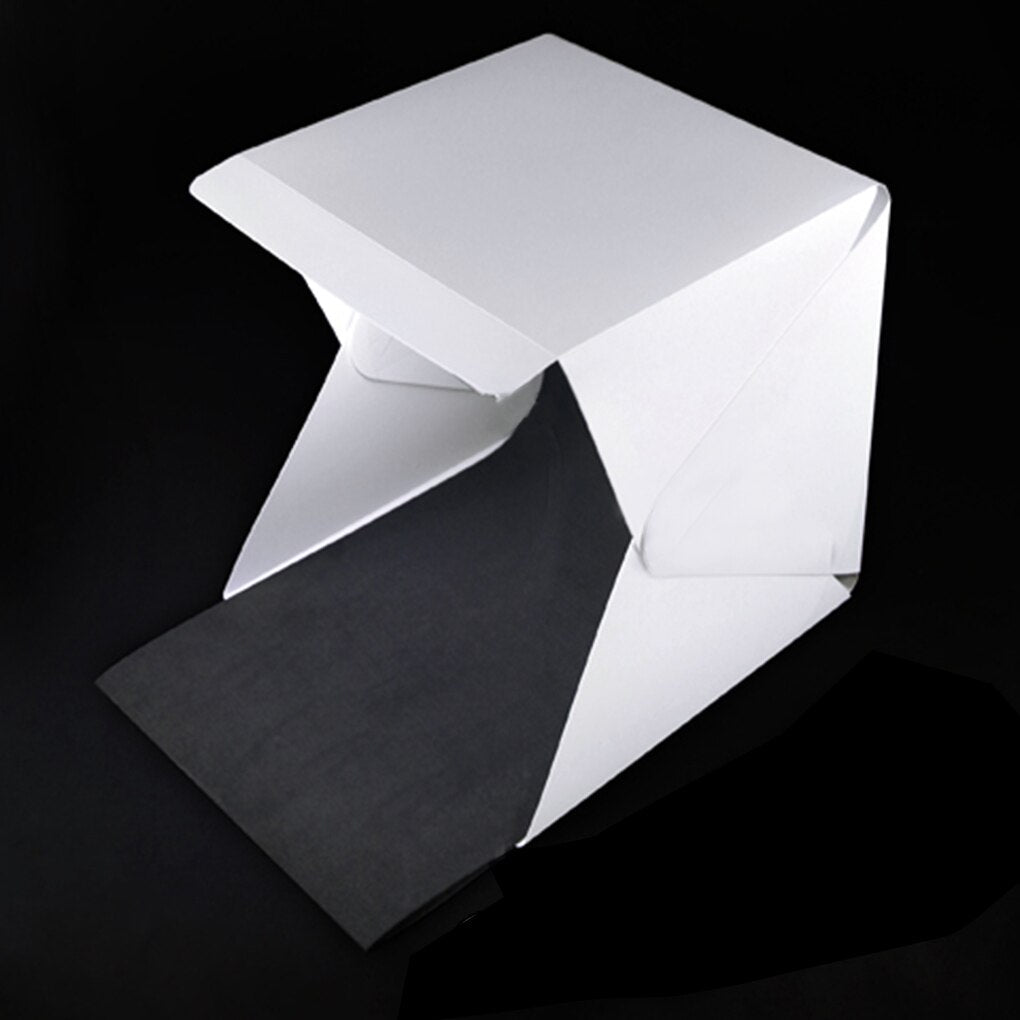 Compact product photo studio kit with integrated LED lights, perfect for small business & online sellers.