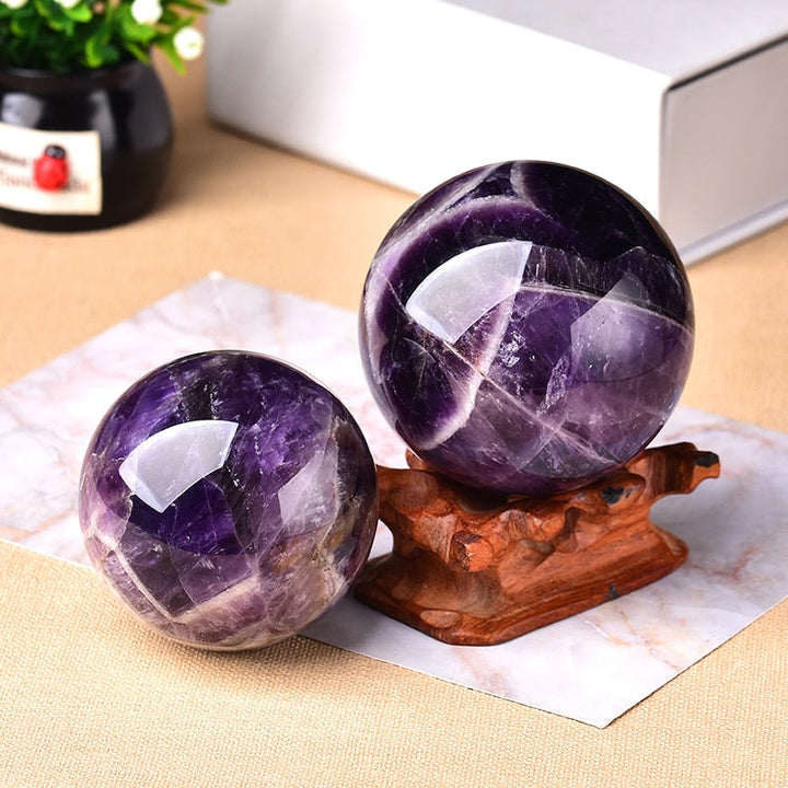 Amethyst crystal sphere, a powerful healing crystal & unique spiritual decor piece.