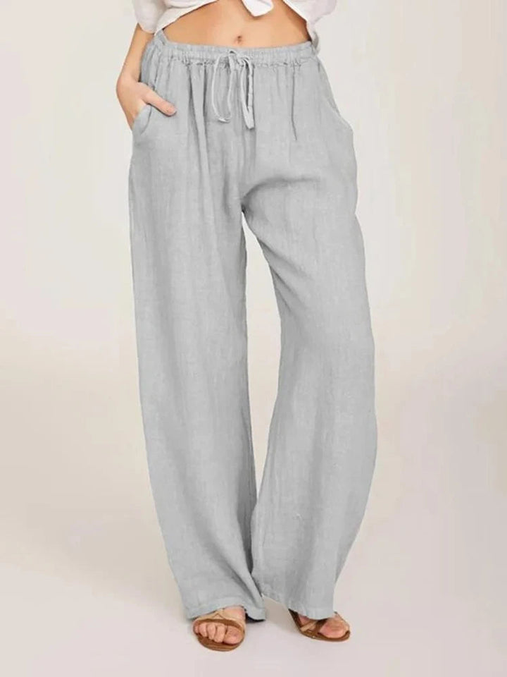 Relaxed fit women's wide-leg pants with adjustable drawstring waist for ultimate comfort.