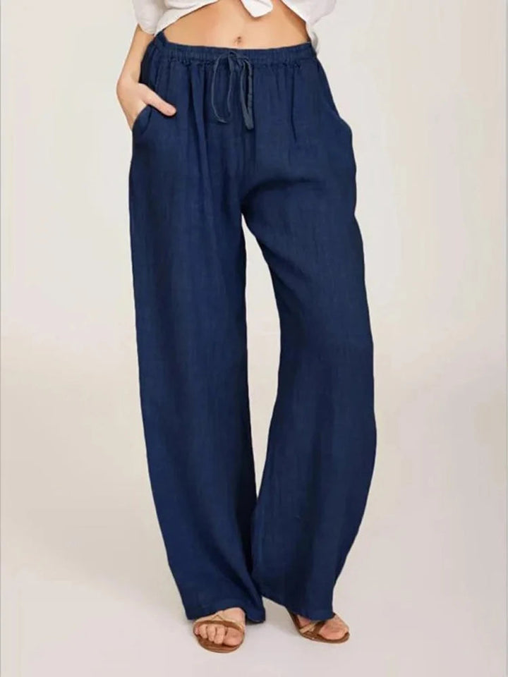 Soft fabric women's casual wide-leg pants featuring a practical drawstring waist for a perfect fit.