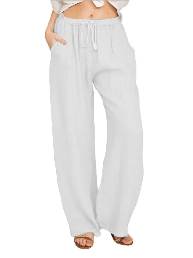 Woman poses in comfortable wide-leg drawstring pants, showcasing versatile everyday casual style.