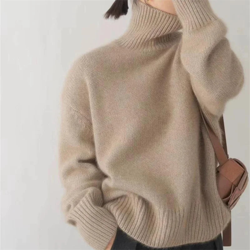 Chic women's oversized turtleneck sweater, fall style, cozy knit, perfect for daily wear.