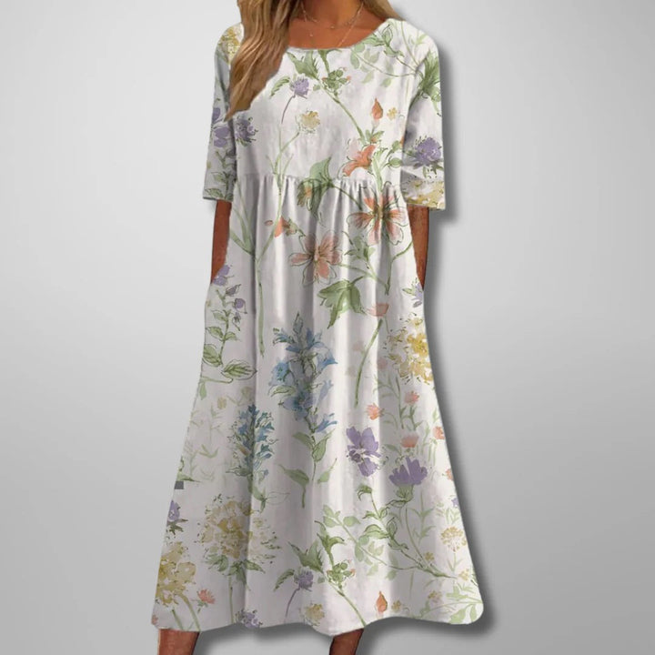 Casual women's floral midi dress. Relaxed fit in navy blue. Ideal for everyday spring & summer comfort & style.