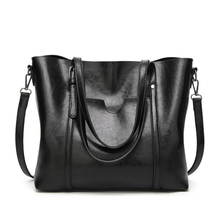High-quality genuine leather women's crossbody handbag, durable, elegant fashion accessory.