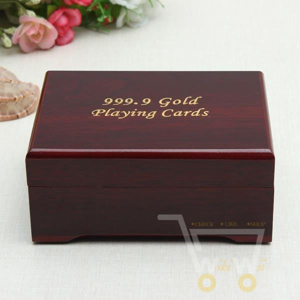 Sophisticated 24K gold-plated playing cards and wooden box set, perfect for a luxury game night.