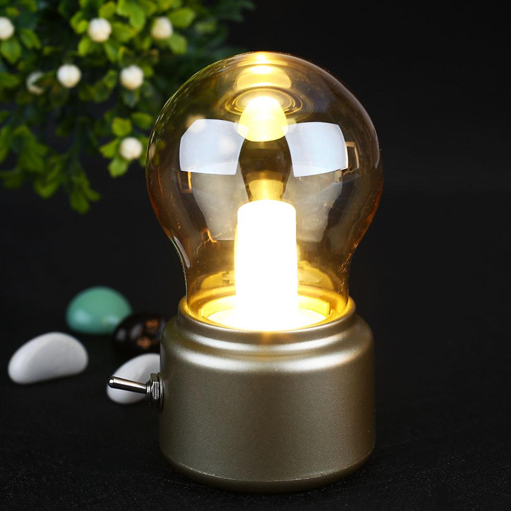 Elegant retro LED table lamp with USB charging. Emits a cozy warm glow, great for reading & decor.