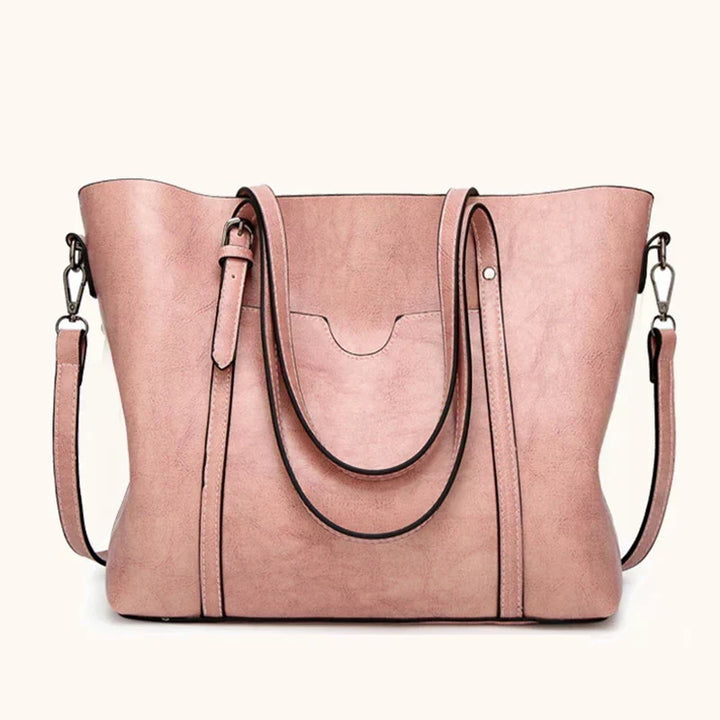 Close-up of elegant women's luxury genuine leather crossbody handbag texture, durable & stylish.