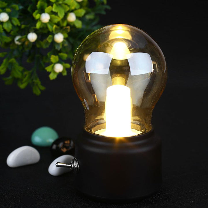 Compact USB rechargeable retro desk lamp featuring a warm LED glow, perfect for vintage home accents.