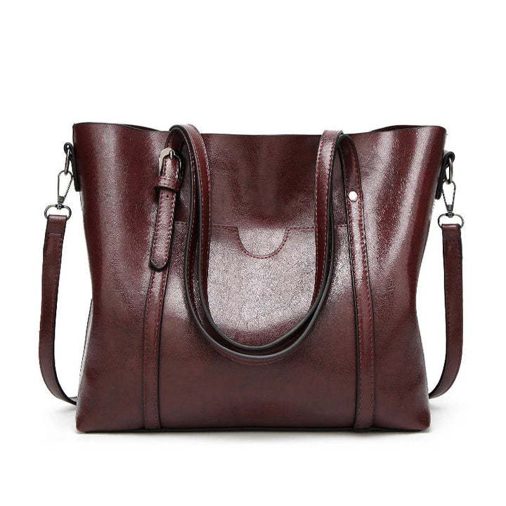 Detailed shot of women's luxury genuine leather shoulder bag, featuring elegant design.