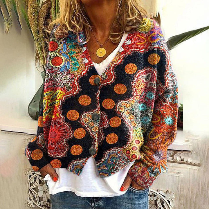 Women's Bohemian chic colorful knitted sweater with vibrant ethnic patterns. Relaxed fit for casual, stylish wear.