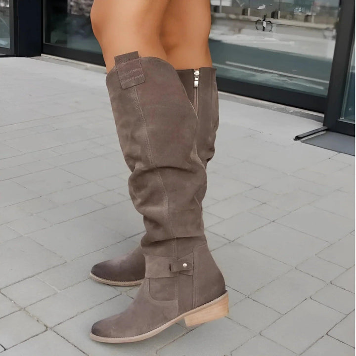 Women's dark green knee-high boots, offering elegant style & superior all-day comfort. Perfect for winter fashion.