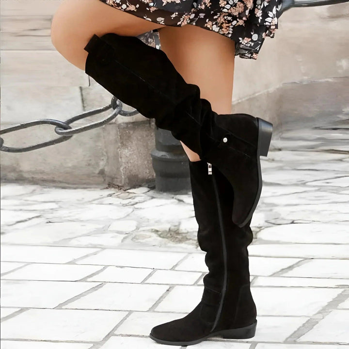 Elegant women's knee-high boots with all-day comfort. Perfect for versatile style and sophisticated fall fashion.