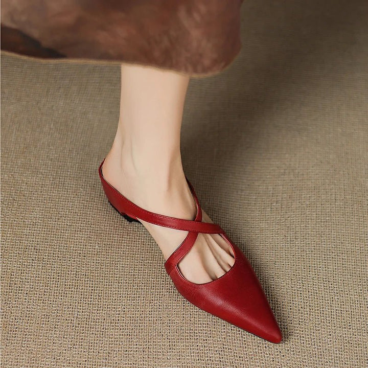 Stylish women's pointed-toe Eloise mules with chic cross-straps. Perfect low-heel slip-on dress shoes.