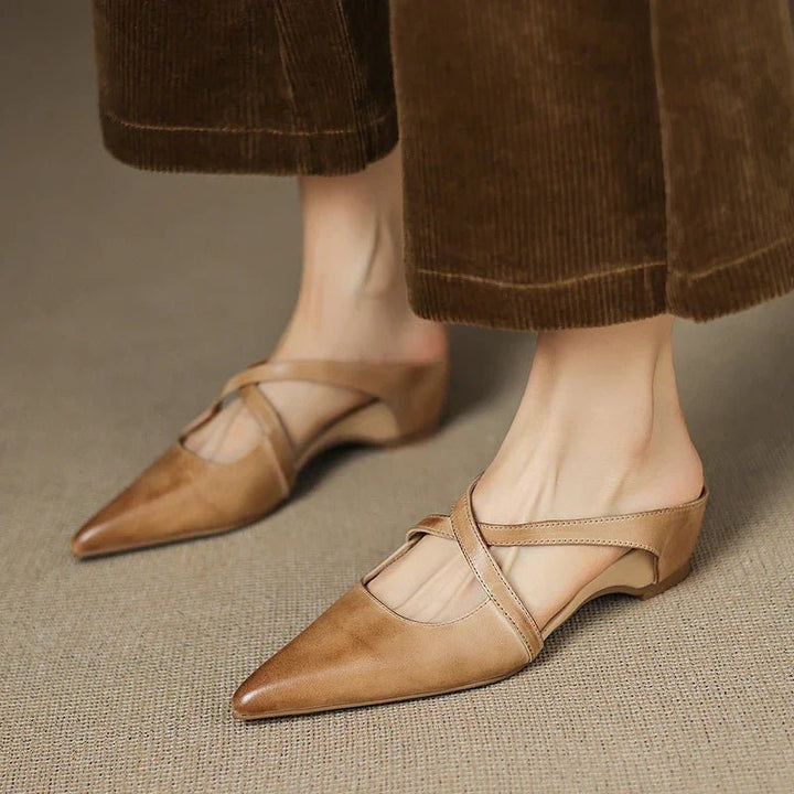 Chic women's Eloise mules, pointed toe and cross-strap design for elegant, comfortable slip-on wear.