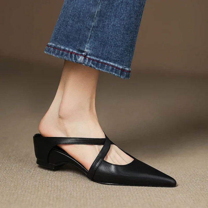 Dressy yet casual women's Eloise slip-on mules, featuring a pointed toe and elegant cross-straps.