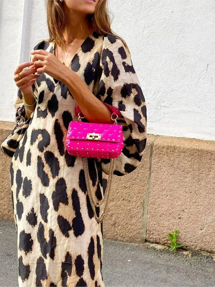 Women's chic leopard print midi dress, perfect for versatile day to night fashion.