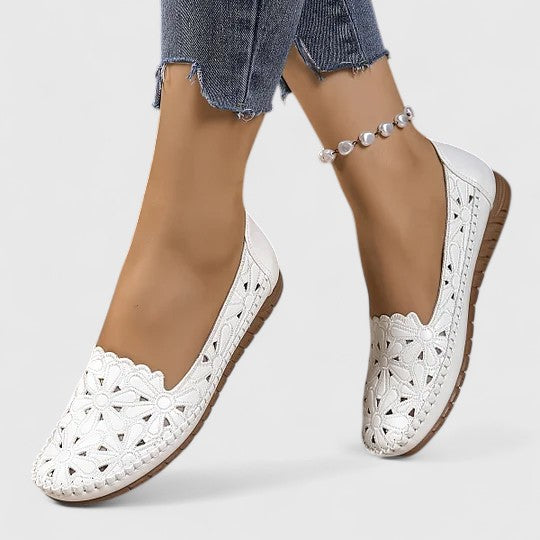 Women's perforated slip-on flats, breathable & comfortable for everyday wear.