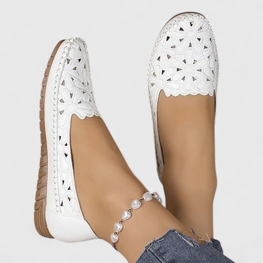 Comfortable breathable women's slip-on flats with perforated design, ideal for daily style.