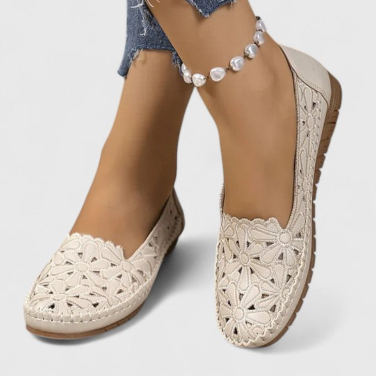 Spring fashion women's perforated flats, comfortable and stylish slip-on shoes.