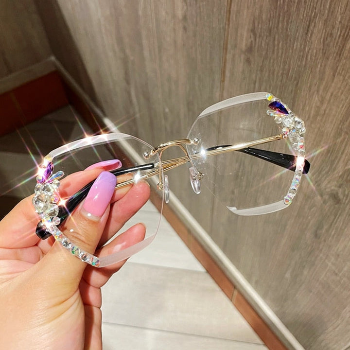 Elegant rimless rhinestone women's sunglasses with a gold frame, perfect for vintage-inspired style.