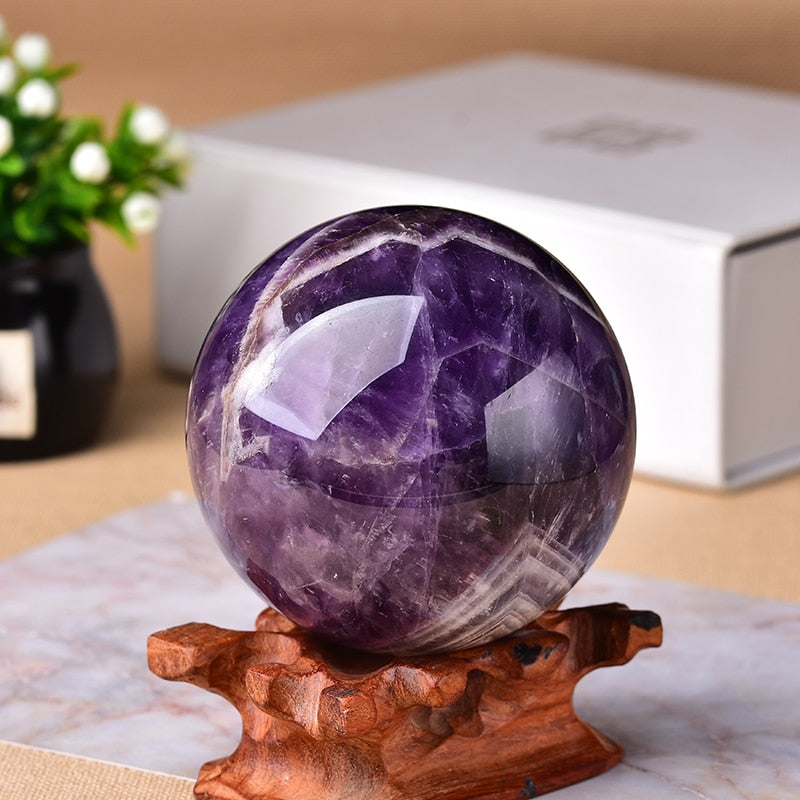 Polished amethyst crystal sphere for elegant home decor. A spiritual accent piece.