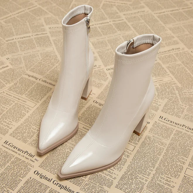Women's versatile black high heel ankle boots, essential for a fashionable wardrobe.