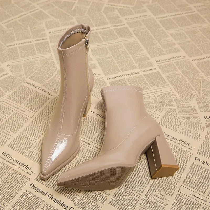 Sleek women's ankle boots with a stylish high block heel, perfect for any occasion.
